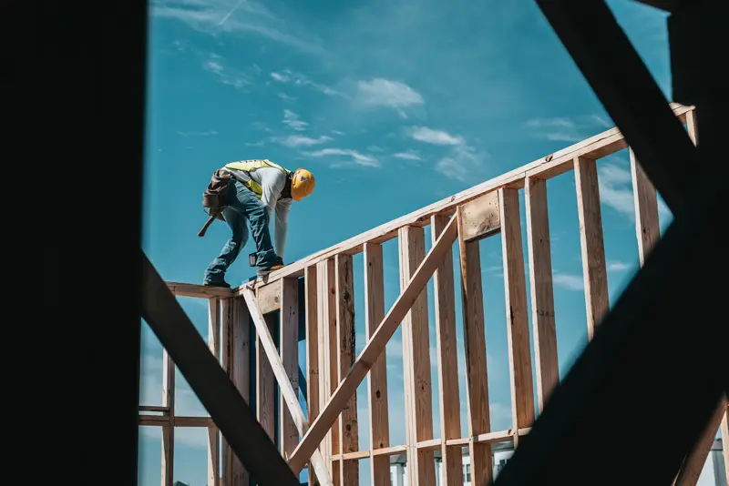 Roof framing against blue sky