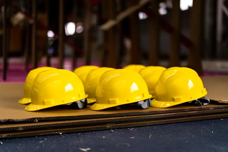Hard hats lined up on site