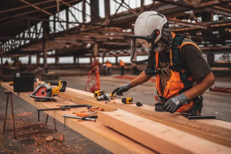 Carpenter working in a timber-frame shop